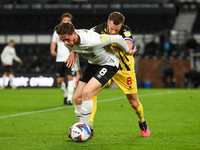 
Max Bird of Derby County holds off Tom Cleverley of Watford during the Sky Bet Championship match between Derby County and Watford at the P...