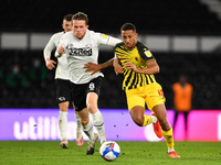 
Joao Pedro of Watford battles with Max Bird, during the Sky Bet Championship match between Derby County and Watford at the Pride Park, Derb...
