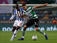 Zouhair Feddal of Sporting CP (R ) vies with Nanu of FC Porto during the Portuguese League football match between Sporting CP and FC Porto a...