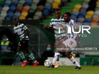 Wilson Manafa of FC Porto (R ) vies with Jovane Cabral of Sporting CP during the Portuguese League football match between Sporting CP and FC...