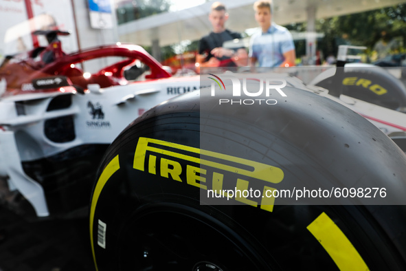 Pirelli logo is seen on a tyre of the Formula 1 car Sauber C-37 in the livery of Alfa Romeo Racing-Ferrari, in the showcase at a gas station...