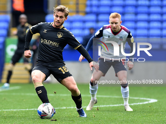 Bolton Wanderers' Ali Crawford ands Oldham Athletic's Conor McAleny in action during the Sky Bet League 2 match between Bolton Wanderers and...