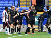 Oldham Athletic's Ben Garrity is congratulated after scoring his sides  opening goal during the Sky Bet League 2 match between Bolton Wander...