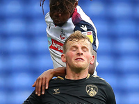  Boltons Peter Kioso clashes with Oldhams Danny Rowe during the Sky Bet League 2 match between Bolton Wanderers and Oldham Athletic at the R...
