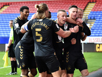 Oldham Athletic's Zak Dearnley celebrates scoring his sides winning goal during the Sky Bet League 2 match between Bolton Wanderers and Oldh...