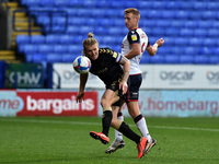 Bolton Wanderers' Ein Doyle  ands Oldham Athletic's Carl Piergianni in action during the Sky Bet League 2 match between Bolton Wanderers and...