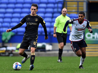 Bolton Wanderers' Brandon Comley ands Oldham Athletic's Callum Whelan in action during the Sky Bet League 2 match between Bolton Wanderers a...