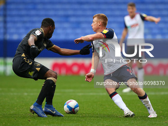  Boltons Eoin Doyle wrong foots Oldhams Sida Jombati during the Sky Bet League 2 match between Bolton Wanderers and Oldham Athletic at the R...