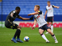  Boltons Eoin Doyle wrong foots Oldhams Sida Jombati during the Sky Bet League 2 match between Bolton Wanderers and Oldham Athletic at the R...