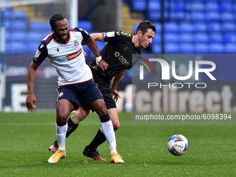 Bolton Wanderers' Ricardo Santos Oldham Athletic's Ben Garrity in action during the Sky Bet League 2 match between Bolton Wanderers and Oldh...