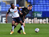 Bolton Wanderers' Ricardo Santos Oldham Athletic's Ben Garrity in action during the Sky Bet League 2 match between Bolton Wanderers and Oldh...