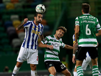 Sergio Oliveira of FC Porto (L) vies with Pedro Goncalves of Sporting CP (C ) during the Portuguese League football match between Sporting C...