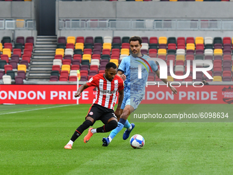 Rico Henry, Josh Pask during the Sky Bet Championship match between Brentford and Coventry City at Brentford Community Stadium on October 17...