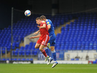 Ipswich Towns James Wilson And Accringtons Joe Pritchard go head to head in the air for the ball during the Sky Bet League 1 match between I...