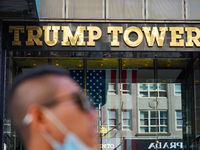 A man wearing a mask improperly walks past the trump tower. New York City continues Phase 4 of re-opening following restrictions imposed to...