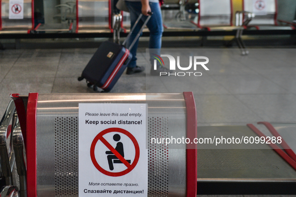 A view of a warning sign 'Keep Social Distance' seen inside the departures hall in Burgas Airport.
Passenger numbers at Bulgaria's coastal a...