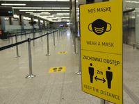 A board with COVID-19 related rules seen in the Departures Hall at Krakow's Airport.
Poland is the latest European country to tighten restri...
