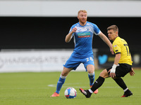 Chris Taylor of Barrow in action with Lloyd Kerry  during the Sky Bet League 2 match between Harrogate Town and Barrow at Wetherby Road, Har...