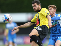 Connor Hall of Harrogate Town and Luke James of Barrow during the Sky Bet League 2 match between Harrogate Town and Barrow at Wetherby Road,...