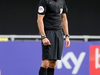 The match referee Seb Stockbridge during the Sky Bet League 2 match between Harrogate Town and Barrow at Wetherby Road, Harrogate, England o...