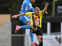 Patrick Brough of Barrow contests a header with Jack Muldoon of Harrogate Town during the Sky Bet League 2 match between Harrogate Town and...