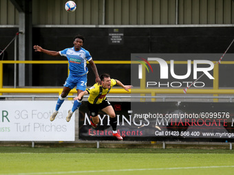 Kgosi Ntlhe of Barrow contests a header with Harrogate Town's  Ryan Fallowfield of Harrogate Town during the Sky Bet League 2 match between...