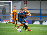 Alex Newby of Rochdale AFC under pressure from Greg Docherty of Hull City FC during the Sky Bet League 1 match between Rochdale and Hull Cit...