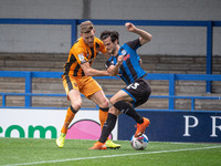Jimmy Keohane of Rochdale AFC tangles with Callum Elder of Hull City FC during the Sky Bet League 1 match between Rochdale and Hull City at...