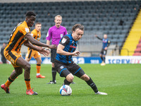 Ollie Rathbone of Rochdale AFC under pressure from Josh Emmanuel of Hull City FC during the Sky Bet League 1 match between Rochdale and Hull...