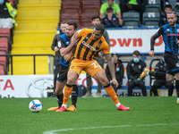 Josh Magennis of Hull City FC holds off Eoghan O'Connell of Rochdale AFC during the Sky Bet League 1 match between Rochdale and Hull City at...