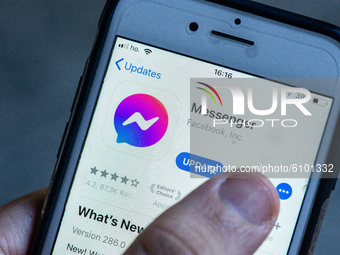 An user updating new version of Messenger in L'Aquila (Italy) on October 18, 2020. Facebook, Messenger app updates and its logo turns purple...