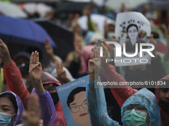 Thai protesters flash a three-finger salute and shout during an anti-government protest in Bangkok, Thailand, 18 October 2020.  (