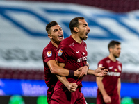 Paulo Vinicius and Denis Ciobotariu, defenders of CFR Cluj celebrating after scoring victory goal during the 7th game in the Romania League...