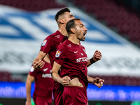 Paulo Vinicius and Denis Ciobotariu, defenders of CFR Cluj celebrating after scoring victory goal during the 7th game in the Romania League...
