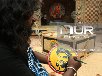 Artist is giving finishing touch to Indian Actor late Sushant Singh Rajput painting a ''Potchitra'' at Paying truibute in honor to Sushant S...