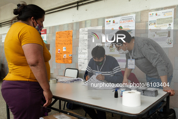 Voters wait their turn outside during the Bolivian presidential elections on October 18, 2020 in Buenos Aires, Argentina. The Bolivian commu...