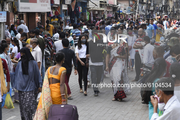 Shoppers croud wearing mask for shopping,  at Fancy Bazar ahead of Hindu Durga puja festival amidst COVID-19 pandemic, in Guwahati, Assam, I...