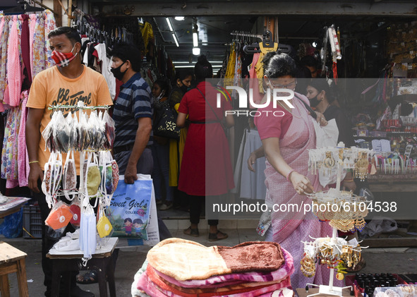 Customers at a store at Fancy Bazar ahead of Hindu Durga puja festival amidst COVID-19 coronavirus pandemic, in Guwahati, Assam, India on Mo...