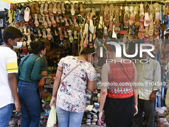 Shoppers at a sandal store at Fancy Bazar ahead of Durga puja festival amidst COVID-19 coronavirus pandemic, in Guwahati, Assam, India on Mo...