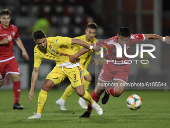George Ganea of Romania U21 in action against Christian Gauci of Malta U21 during the soccer match between Romania U21 and Malta U21 of the...
