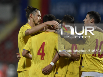 Radu Dragusin, George Ganea and Dennis Man of Romania U21 celebrate during  the soccer match between Romania U21 and Malta U21 of the Qualif...