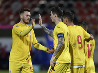Dennis Man and Denis Harut of Romania U21 celebrate during the soccer match between Romania U21 and Malta U21 of the Qualifying Round for th...