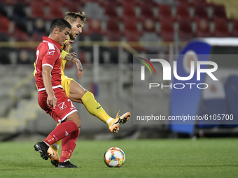 Denis Dragus of Romania U21 in action against Christian Gauci of Malta U21 during the soccer match between Romania U21 and Malta U21 of the...