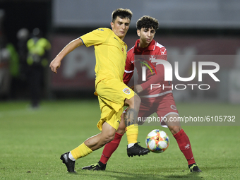 Stefan Vladoiu of Romania U21 in action against Andrea Zammit of Malta U21 during the soccer match between Romania U21 and Malta U21 of the...