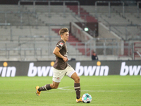 Finn Ole Becker of FC St. Pauli runs with the ball during the Second Bundesliga match between FC St. Pauli and 1. FC Nuernberg at Millerntor...