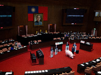 The KMT lawmakers aoccupy the speaker’s podium to prevent Premier Su Tseng-chang from giving his policy address of the session., in Taipei,...