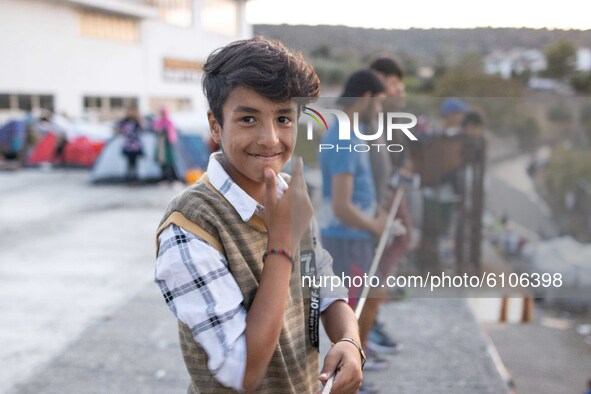 A young refugee boy is smiling. Portraits of young children refugees, minors boys and girls, asylum seekers from various countries such as S...