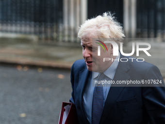 British Prime Minister Boris Johnson leaves 10 Downing Street in central London to attend Cabinet meeting at the Foreign Office on 20 Octobe...