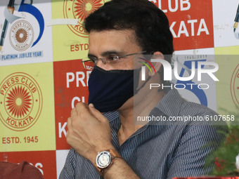 Board of Control for Cricket in India (BCCI) President Sourav Ganguly adjusts his protective face mask during a book release event at Kolkat...