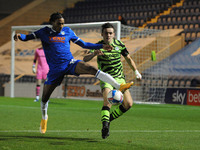 Colchesters Jevani Brown collects the ball ahead of Forest Greens Liam Kitching during the Sky Bet League 2 match between Colchester United...
